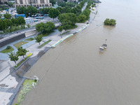 The water level of the Yangtze River is rising above the warning line in Nanjing, China, on June 30, 2024. (