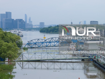 The water level of the Yangtze River is rising above the warning line in Nanjing, China, on June 30, 2024. (