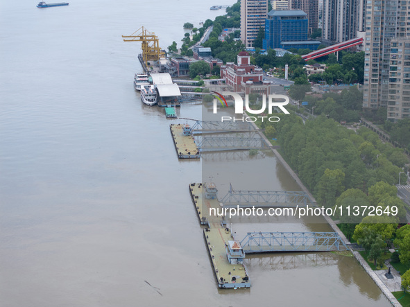 The water level of the Yangtze River is rising above the warning line in Nanjing, China, on June 30, 2024. 