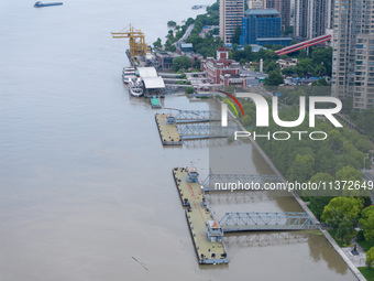 The water level of the Yangtze River is rising above the warning line in Nanjing, China, on June 30, 2024. (