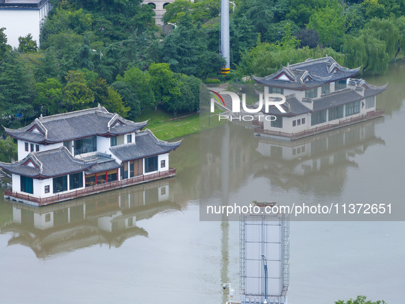 The water level of the Yangtze River is rising above the warning line in Nanjing, China, on June 30, 2024. 