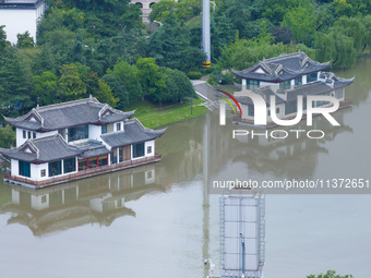 The water level of the Yangtze River is rising above the warning line in Nanjing, China, on June 30, 2024. (