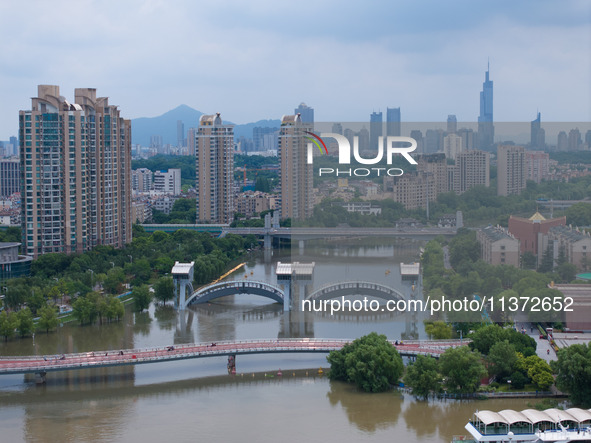 The water level of the Yangtze River is rising above the warning line in Nanjing, China, on June 30, 2024. 