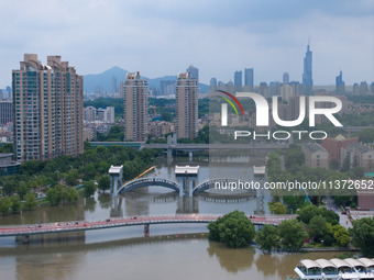 The water level of the Yangtze River is rising above the warning line in Nanjing, China, on June 30, 2024. (