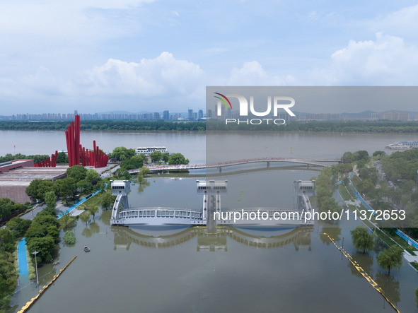 The water level of the Yangtze River is rising above the warning line in Nanjing, China, on June 30, 2024. 