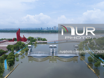 The water level of the Yangtze River is rising above the warning line in Nanjing, China, on June 30, 2024. (