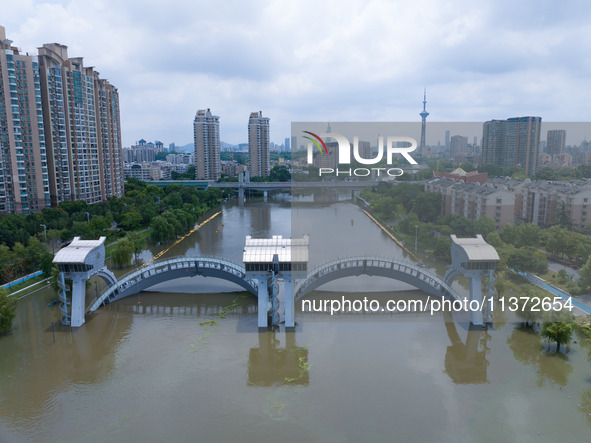 The water level of the Yangtze River is rising above the warning line in Nanjing, China, on June 30, 2024. 