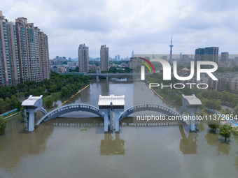 The water level of the Yangtze River is rising above the warning line in Nanjing, China, on June 30, 2024. (