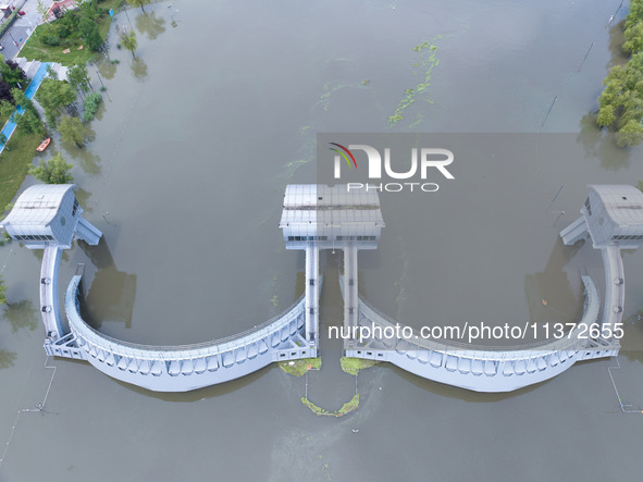 The water level of the Yangtze River is rising above the warning line in Nanjing, China, on June 30, 2024. 