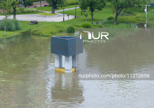 The water level of the Yangtze River is rising above the warning line in Nanjing, China, on June 30, 2024. 