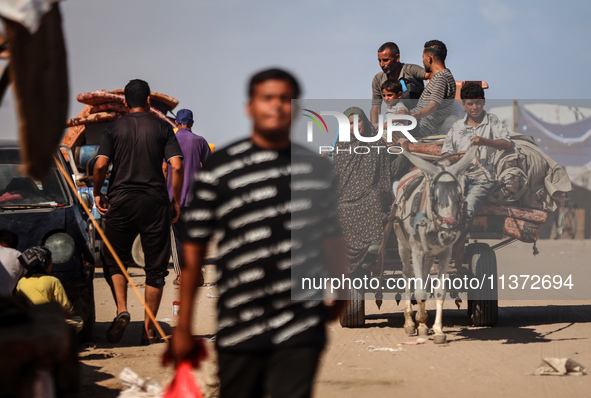 Palestinians are fleeing the al-Mawasi area in western Rafah, in Rafah, Palestine, on June 30, 2024, amid the ongoing conflict between Israe...