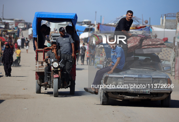 Palestinians are fleeing the al-Mawasi area in western Rafah, in Rafah, Palestine, on June 30, 2024, amid the ongoing conflict between Israe...