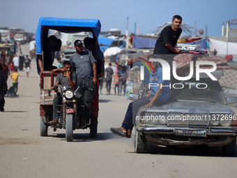 Palestinians are fleeing the al-Mawasi area in western Rafah, in Rafah, Palestine, on June 30, 2024, amid the ongoing conflict between Israe...