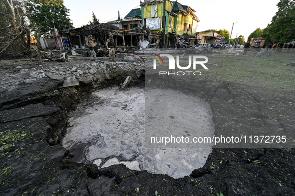 The crater from a Russian missile is being seen in the ground in central Vilniansk, Zaporizhzhia region, southern Ukraine, on June 29, 2024....