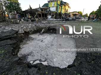 The crater from a Russian missile is being seen in the ground in central Vilniansk, Zaporizhzhia region, southern Ukraine, on June 29, 2024....