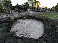 The crater from a Russian missile is being seen in the ground in central Vilniansk, Zaporizhzhia region, southern Ukraine, on June 29, 2024....