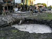 The crater from a Russian missile is being seen in the ground in central Vilniansk, Zaporizhzhia region, southern Ukraine, on June 29, 2024....