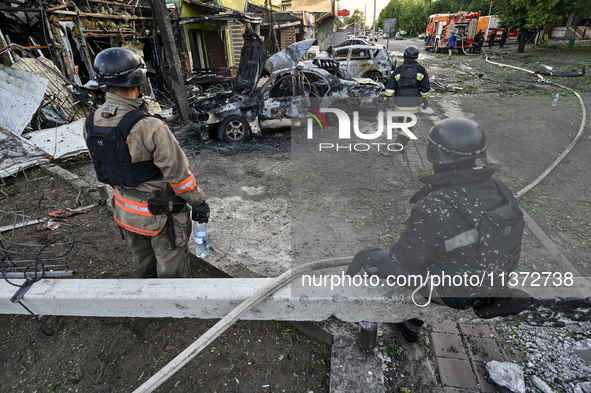 Rescuers are partaking in a response effort to the Russian missile attack in central Vilniansk, Zaporizhzhia region, southern Ukraine, on Ju...