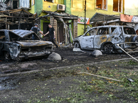 Cars and a building are being damaged by the Russian missile strike in central Vilniansk, Zaporizhzhia region, southern Ukraine, on June 29,...