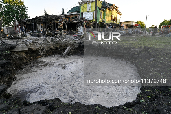 The crater from a Russian missile is being seen in the ground in central Vilniansk, Zaporizhzhia region, southern Ukraine, on June 29, 2024....