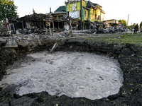 The crater from a Russian missile is being seen in the ground in central Vilniansk, Zaporizhzhia region, southern Ukraine, on June 29, 2024....