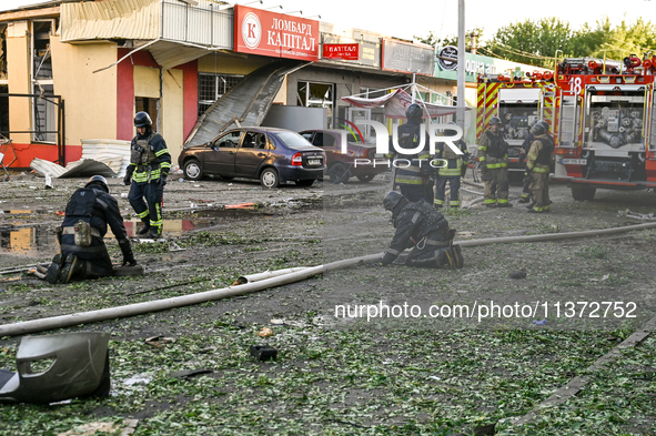 Rescuers are partaking in a response effort to the Russian missile attack in central Vilniansk, Zaporizhzhia region, southern Ukraine, on Ju...