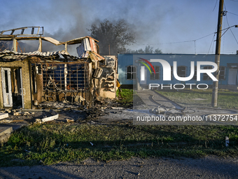 A man is walking past the body of a person killed by the Russian missile attack in central Vilniansk, Zaporizhzhia region, southern Ukraine,...