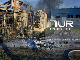 A rescuer is walking past the body of a person killed by the Russian missile attack in central Vilniansk, Zaporizhzhia region, southern Ukra...