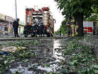 Rescuers are staying by a fire engine during a response effort to the Russian missile attack in central Vilniansk, Zaporizhzhia region, sout...