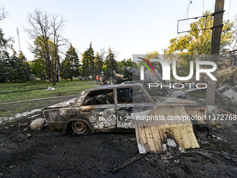 Cars are being destroyed by the Russian missile attack in central Vilniansk, Zaporizhzhia region, southern Ukraine, on June 29, 2024. Russia...