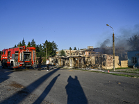 Firefighters are putting out a fire in a building during a response effort to the Russian missile attack in central Vilniansk, Zaporizhzhia...