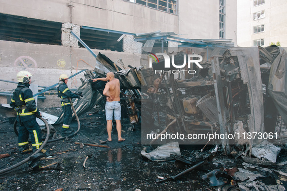 ''Nova Poshta'' trucks are burning as a result of the impact , in Kharkiv, Ukraine, on June 30, 2024. On the afternoon of June 30, 2024, Rus...