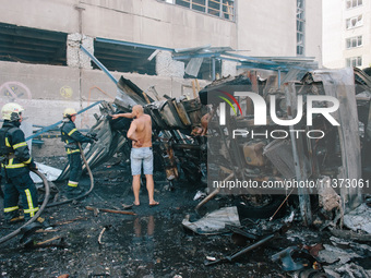 ''Nova Poshta'' trucks are burning as a result of the impact , in Kharkiv, Ukraine, on June 30, 2024. On the afternoon of June 30, 2024, Rus...