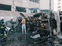 ''Nova Poshta'' trucks are burning as a result of the impact , in Kharkiv, Ukraine, on June 30, 2024. On the afternoon of June 30, 2024, Rus...