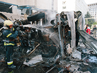 Firefighters are putting out delivery trucks, in Kharkiv, Ukraine, on June 30, 2024. On the afternoon of June 30, 2024, Russia bombed Kharki...