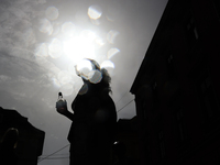 A person cools down at water curtain during the heatwave in Krakow, Poland on June 30, 2024. (