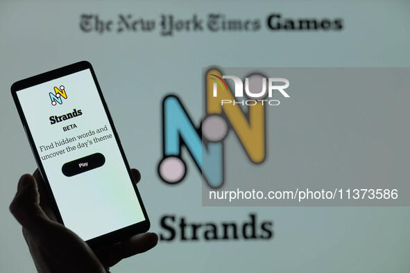 The Strands beta page is being displayed on a smartphone with NYT Games visible in the background in this photo illustration in Brussels, Be...