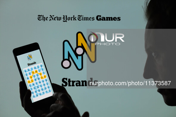 The Strands game is being displayed on a smartphone with NYT Games visible in the background in this photo illustration in Brussels, Belgium...