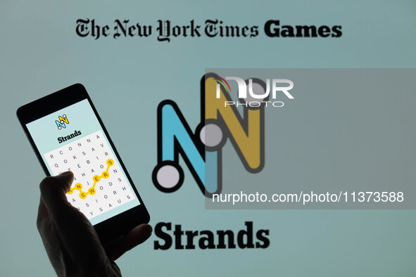 The Strands game is being displayed on a smartphone with NYT Games visible in the background in this photo illustration in Brussels, Belgium...