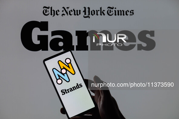 The Strands game logo is being displayed on a smartphone with NYT Games visible in the background in this photo illustration in Brussels, Be...