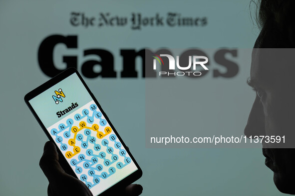 The Strands game is being displayed on a smartphone with NYT Games visible in the background in this photo illustration in Brussels, Belgium...