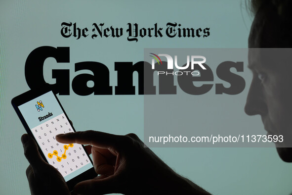 The Strands game is being displayed on a smartphone with NYT Games visible in the background in this photo illustration in Brussels, Belgium...