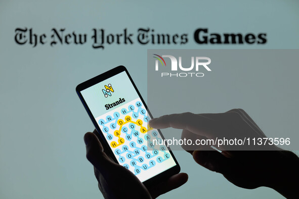 The Strands game is being displayed on a smartphone with NYT Games visible in the background in this photo illustration in Brussels, Belgium...