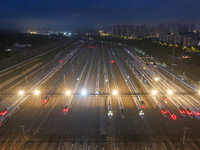 Bullet trains are stopping at the Nanjing section in Nanjing, Jiangsu province, China, in the early morning of July 1, 2024. (