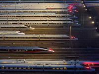 Bullet trains are stopping at the Nanjing section in Nanjing, Jiangsu province, China, in the early morning of July 1, 2024. (