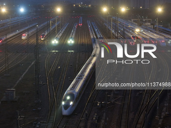 A bullet train is pulling out of the Nanjing Bullet train section in Nanjing, Jiangsu province, China, on July 1, 2024. (