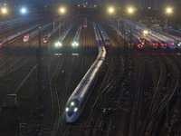 A bullet train is pulling out of the Nanjing Bullet train section in Nanjing, Jiangsu province, China, on July 1, 2024. (