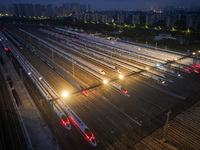 Bullet trains are stopping at the Nanjing section in Nanjing, Jiangsu province, China, in the early morning of July 1, 2024. (