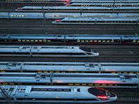 Bullet trains are stopping at the Nanjing section in Nanjing, Jiangsu province, China, in the early morning of July 1, 2024. (