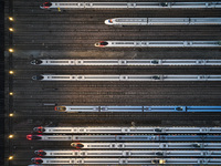 Bullet trains are stopping at the Nanjing section in Nanjing, Jiangsu province, China, in the early morning of July 1, 2024. (